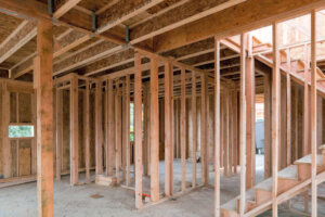 New home construction interior wood stud framing ceiling beams and stair - New Leaf Home Repair and Remodeling